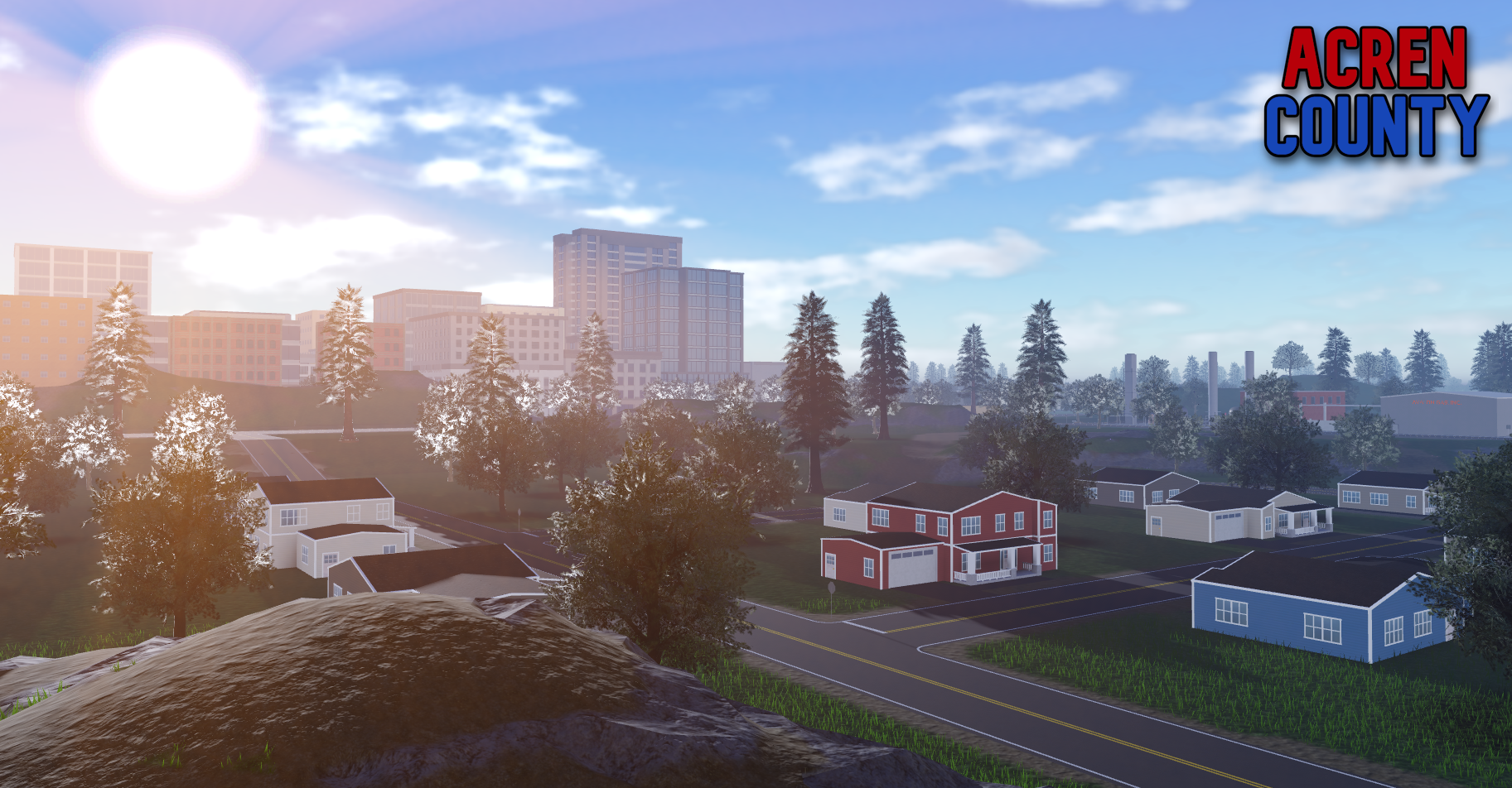 Sunset landscape with mountains, city, and suburbs